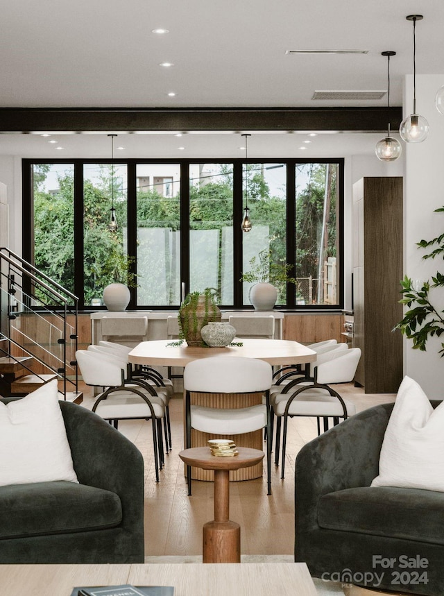 living room with light hardwood / wood-style floors and plenty of natural light