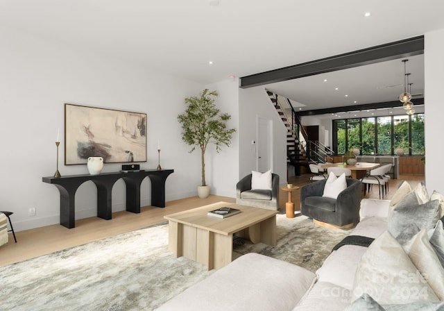 living room featuring light hardwood / wood-style floors and beam ceiling