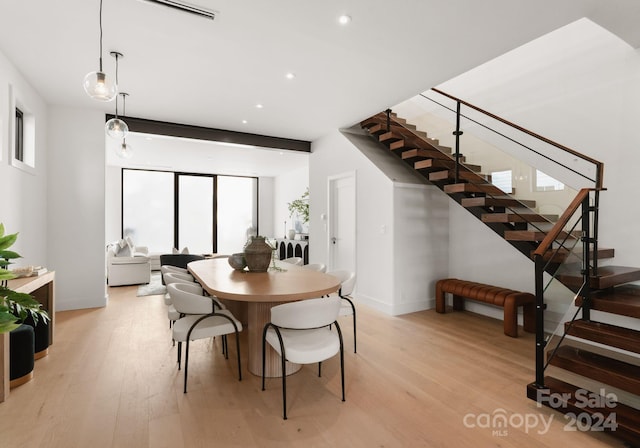 dining area featuring light wood-type flooring