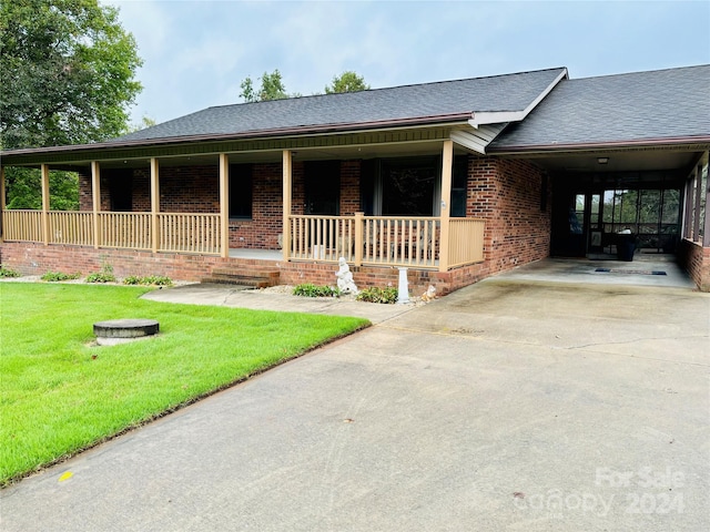 view of front of house with a porch and a front lawn