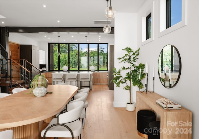 dining space with light wood-type flooring