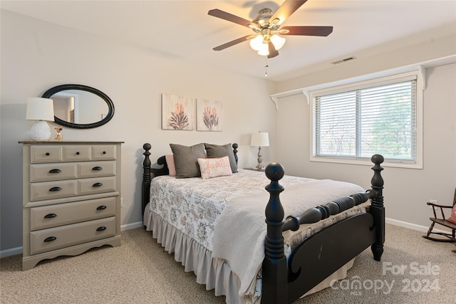 bedroom featuring light carpet and ceiling fan