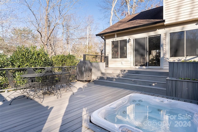 wooden terrace featuring area for grilling