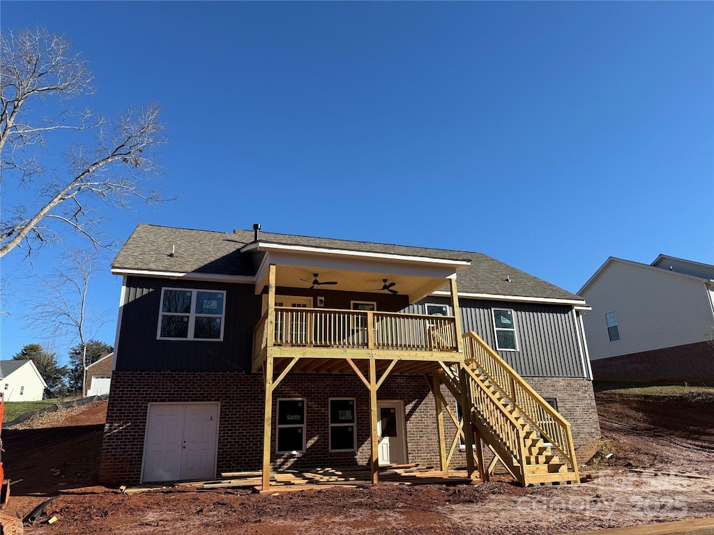 back of house featuring ceiling fan and a wooden deck