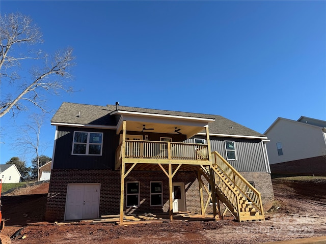 back of house featuring ceiling fan and a wooden deck