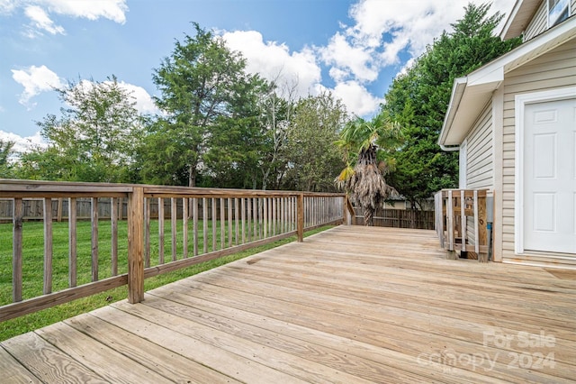 wooden deck with a yard