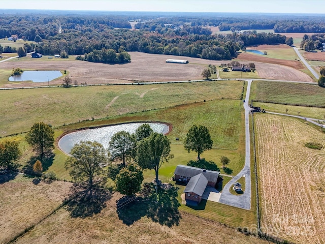 drone / aerial view featuring a water view and a rural view