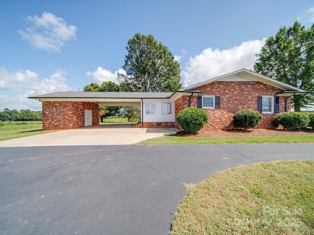 ranch-style home with a carport