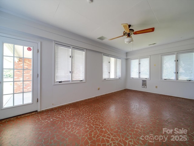 empty room with crown molding and ceiling fan