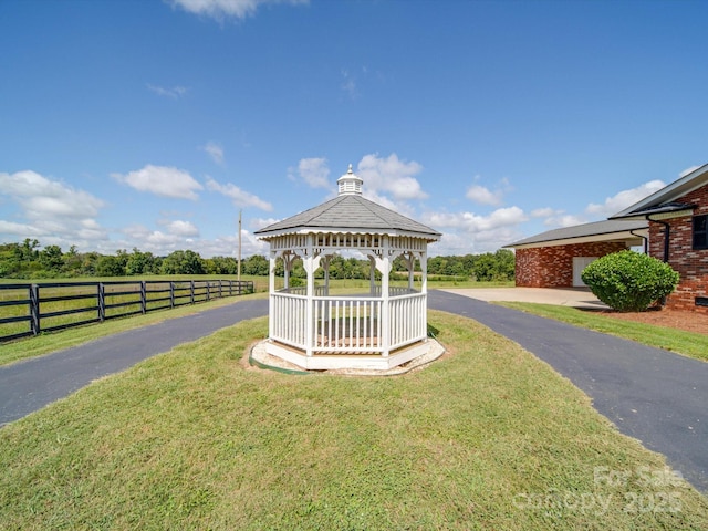 view of community featuring a gazebo and a lawn