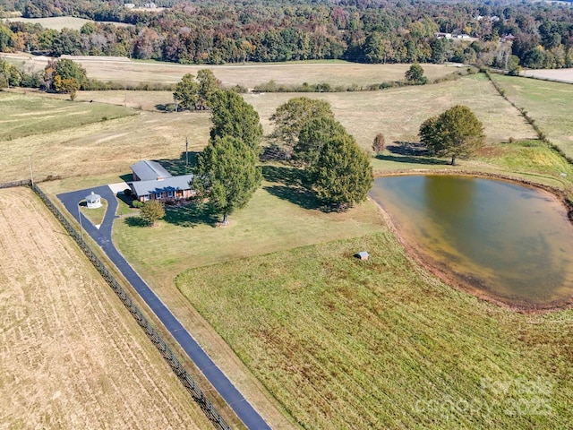 drone / aerial view featuring a water view and a rural view