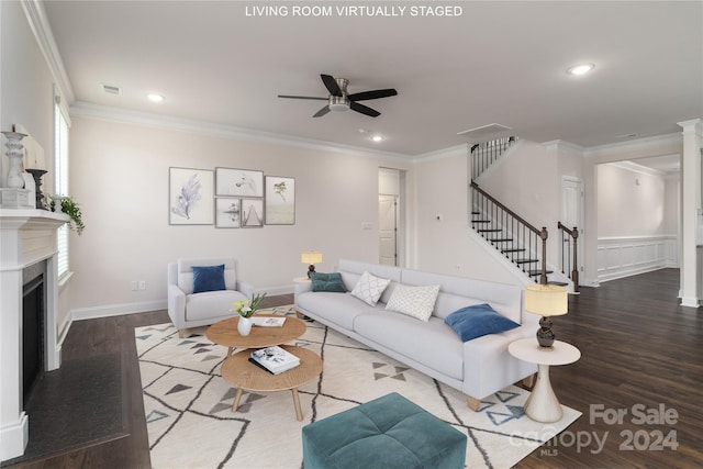 living room featuring ornamental molding, ceiling fan, and hardwood / wood-style flooring