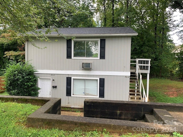 back of house featuring a deck