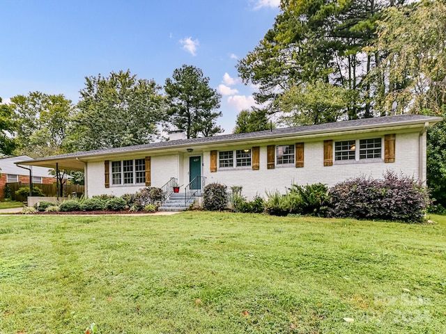 ranch-style home featuring a front yard