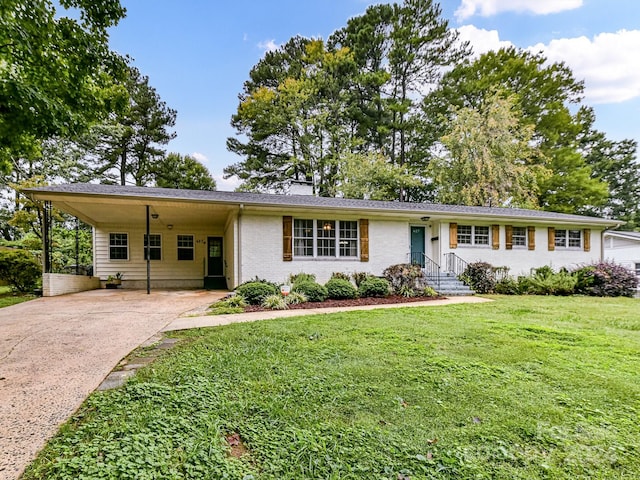 ranch-style house with a front yard and a carport