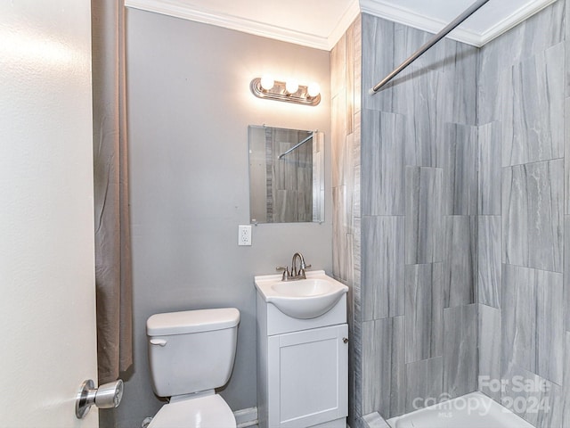 bathroom with walk in shower, vanity, ornamental molding, and toilet