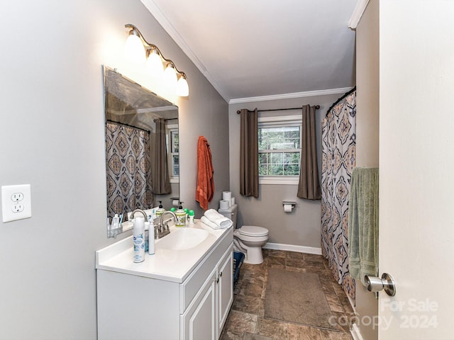 bathroom featuring ornamental molding, vanity, and toilet