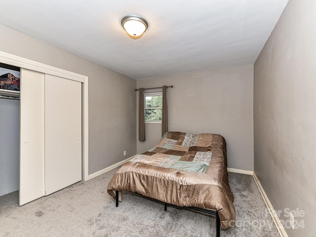 bedroom featuring a closet and carpet flooring