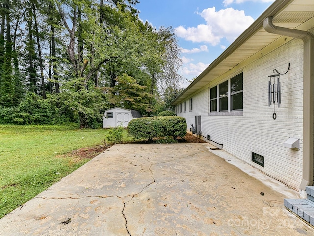 view of patio / terrace with a shed