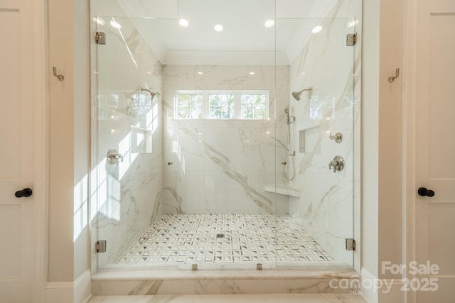 bathroom featuring a shower with shower door