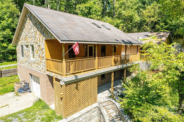 back of property featuring a garage