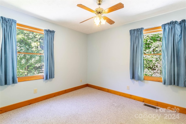 carpeted empty room with ceiling fan