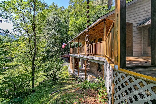 view of side of property with a deck