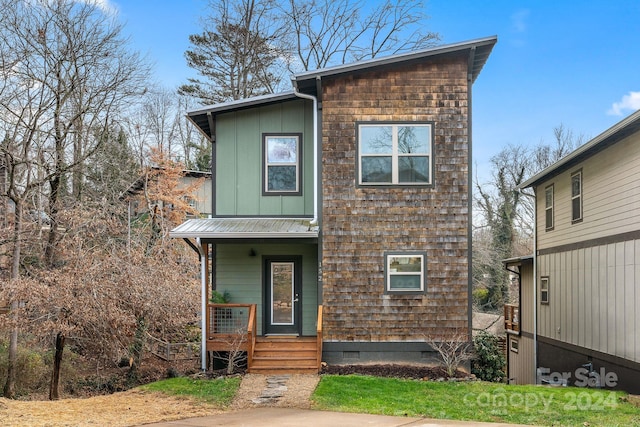 view of property featuring a porch