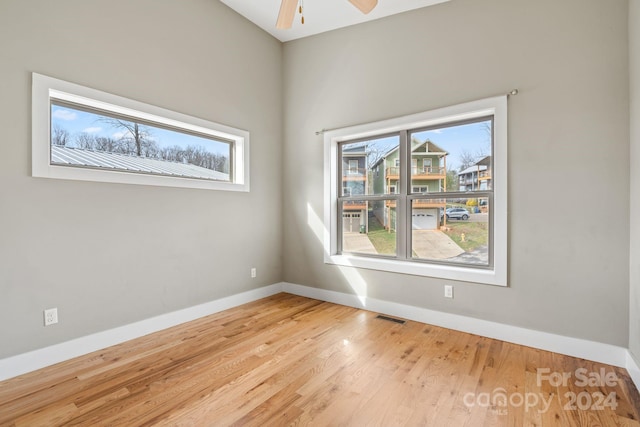 spare room with light hardwood / wood-style floors and ceiling fan