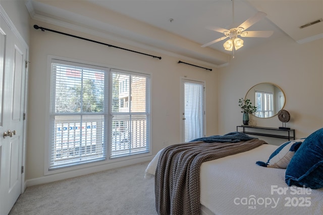 bedroom featuring multiple windows, crown molding, light colored carpet, and ceiling fan