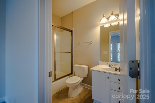 full bathroom with tile patterned flooring, vanity, toilet, and combined bath / shower with glass door