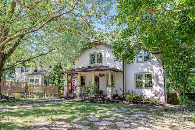 view of front of home featuring a front lawn and a porch