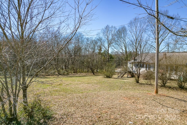 view of yard featuring stairway