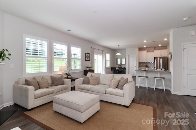 living room featuring dark hardwood / wood-style flooring