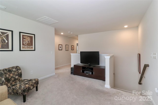 living area with light colored carpet