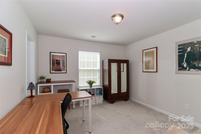 office area featuring light colored carpet