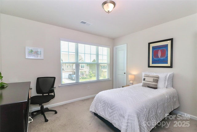 bedroom featuring light colored carpet