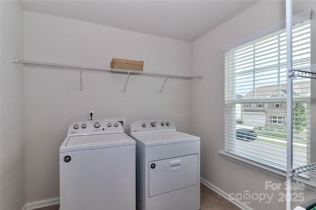 laundry room featuring washing machine and clothes dryer