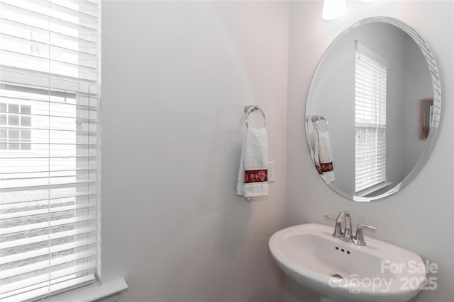 bathroom featuring sink and a healthy amount of sunlight