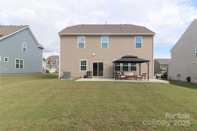 rear view of property with a patio area, central AC, a gazebo, and a yard