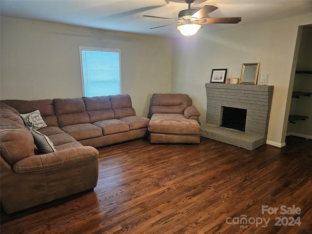 living room featuring a fireplace, dark hardwood / wood-style flooring, and ceiling fan