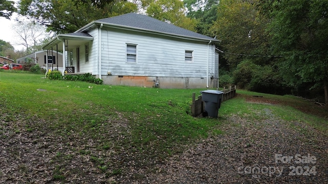 view of home's exterior featuring a lawn