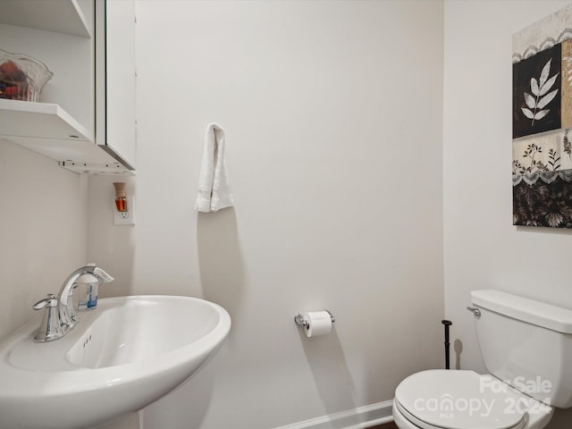 bathroom with sink and toilet