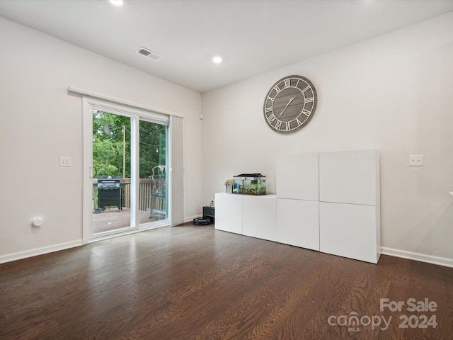 unfurnished room featuring dark hardwood / wood-style floors