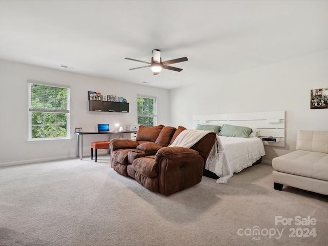 carpeted bedroom with ceiling fan