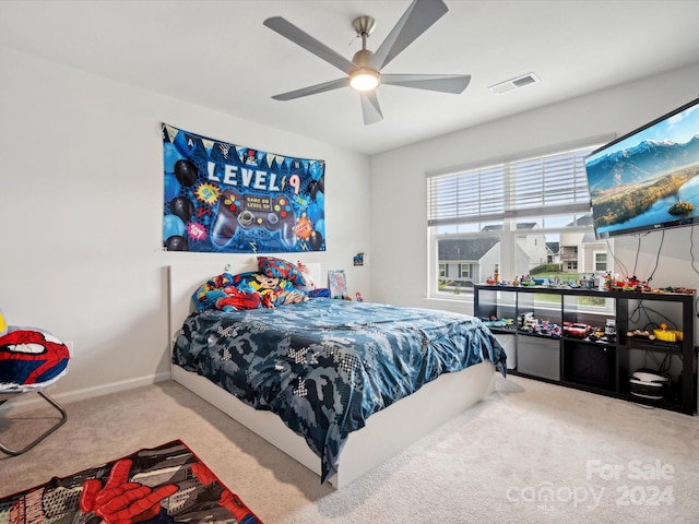 bedroom featuring ceiling fan and carpet floors