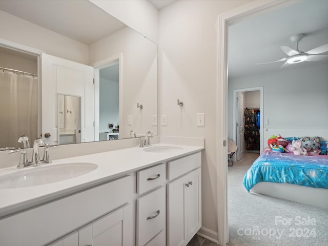 bathroom featuring ceiling fan and vanity