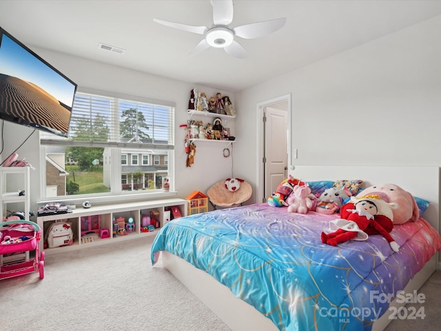 carpeted bedroom featuring ceiling fan