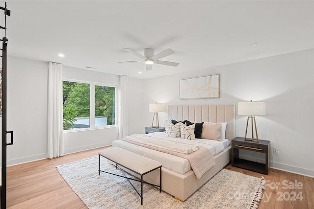 bedroom featuring ceiling fan and light hardwood / wood-style flooring