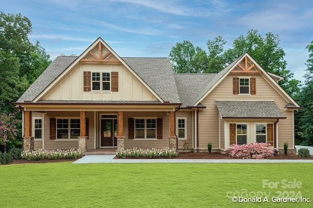 view of front of home with a front lawn and covered porch